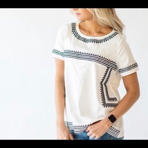 White and blue top from Mindy Mae’s Market